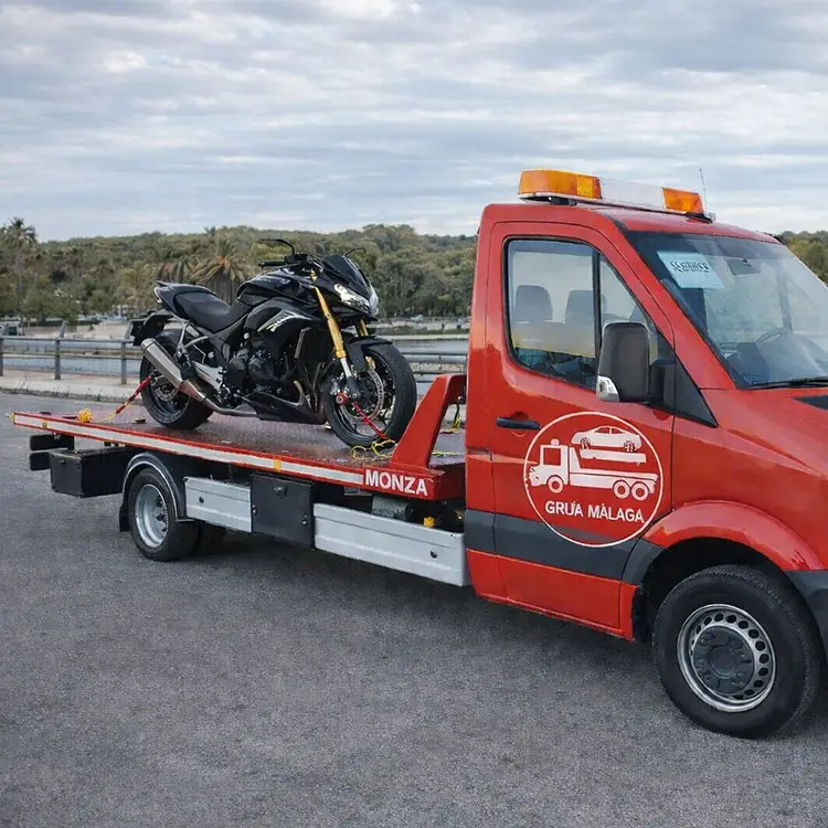 trabajo realizado por grua malaga - transporte moto